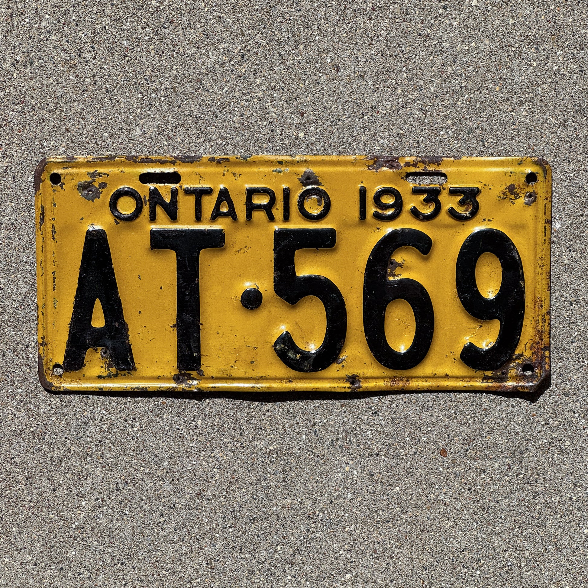 Photo of a 1933 Ontario License Plate Auto Tag Garage Decor Vintage AT 569 with original patina