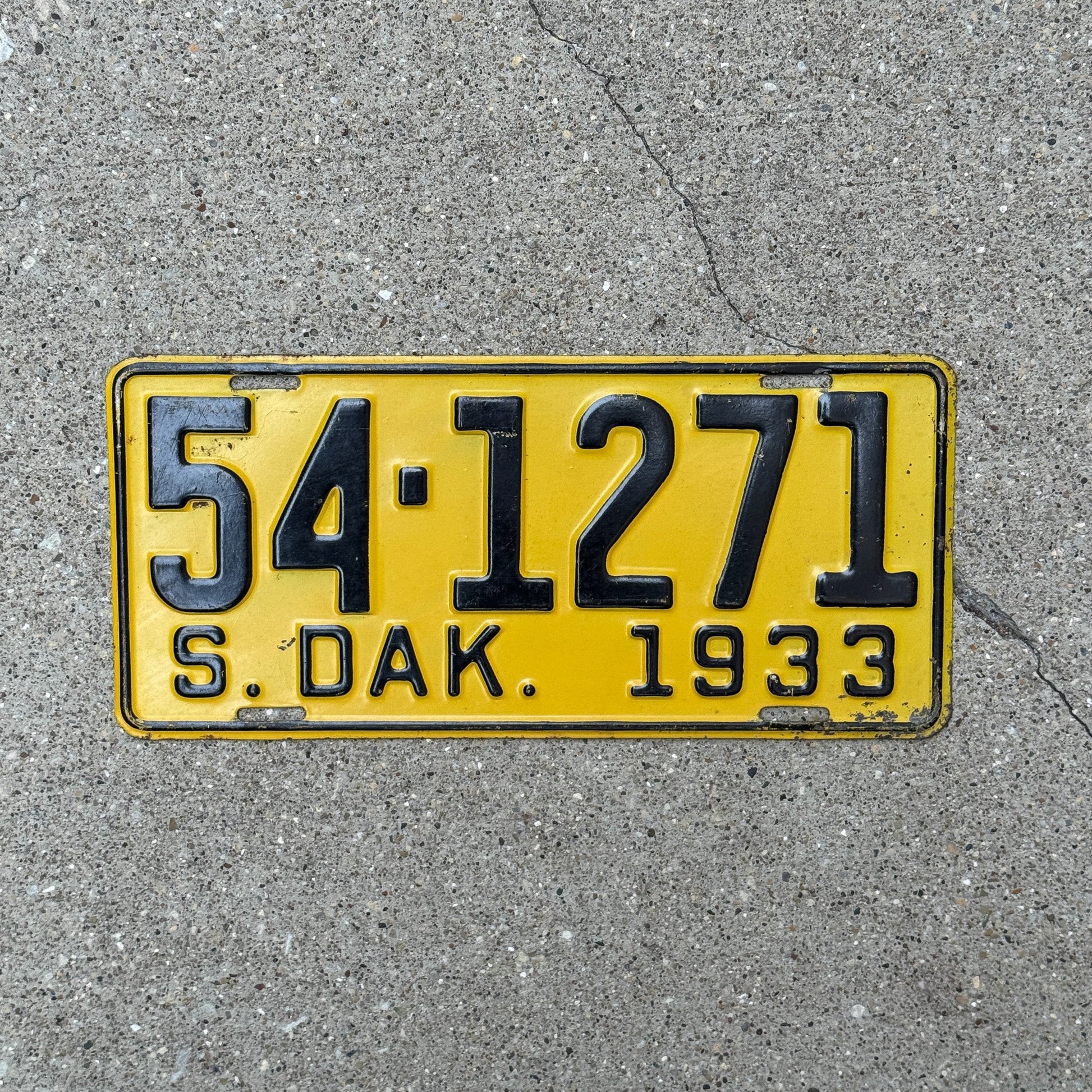 Photo of a 1933 South Dakota License Plate Auto Tag Garage Decor Vintage 54 1271 with original patina