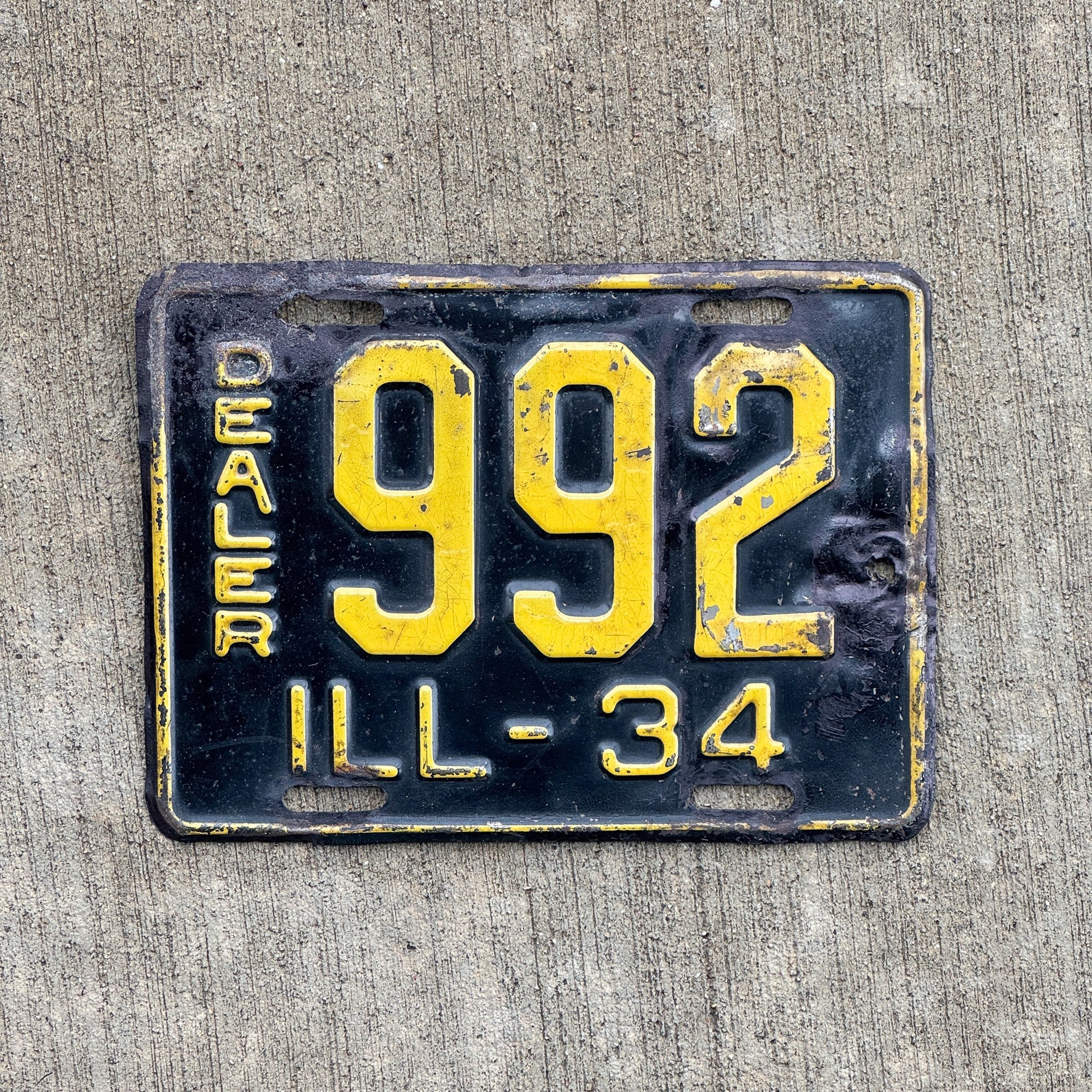 Photo of a 1934 Illinois Dealer License Plate Auto Tag Garage Decor Vintage Low Number Three Digit 992 with original patina