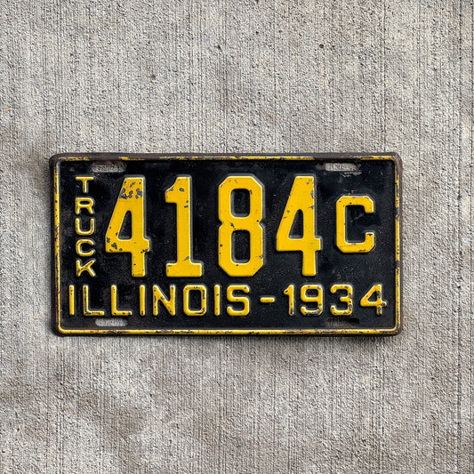 Photo of a 1934 Illinois Truck License Plate Auto Tag Garage Decor Vintage 4184 C with original patina