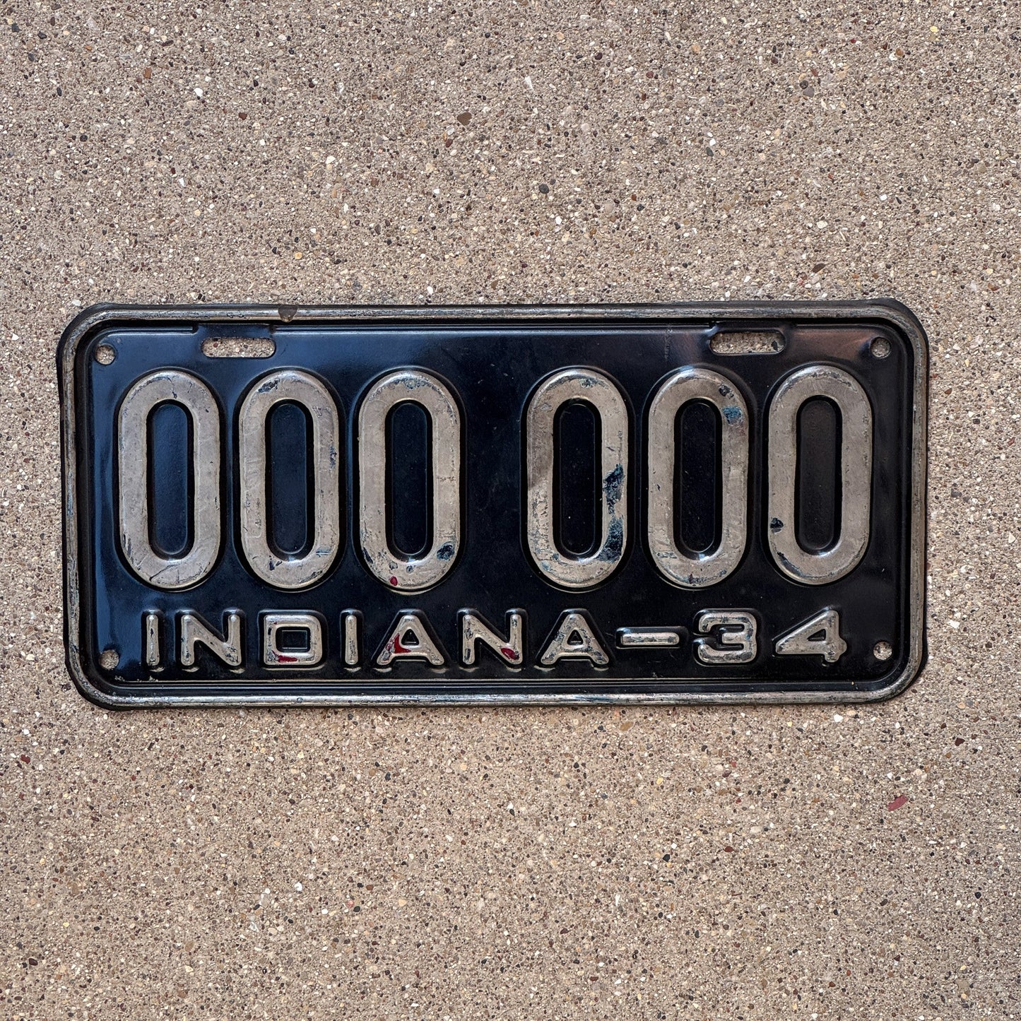 Photo of a 1934 Indiana Sample License Plate Auto Tag Garage Decor Vintage 000 000 with original patina