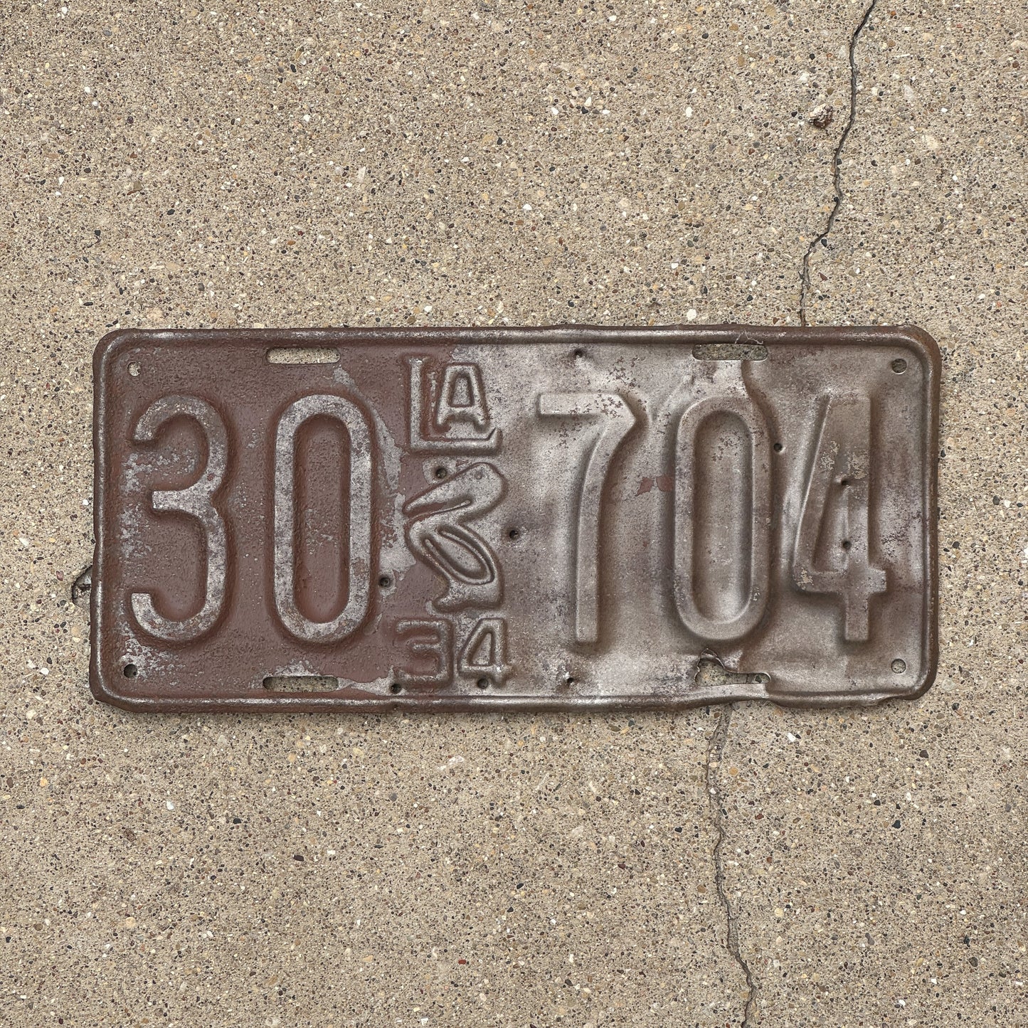 Photo of a 1934 Louisiana License Plate Auto Tag Garage Decor Vintage Iconic Pelican 30 704 with original patina