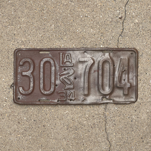Photo of a 1934 Louisiana License Plate Auto Tag Garage Decor Vintage Iconic Pelican 30 704 with original patina