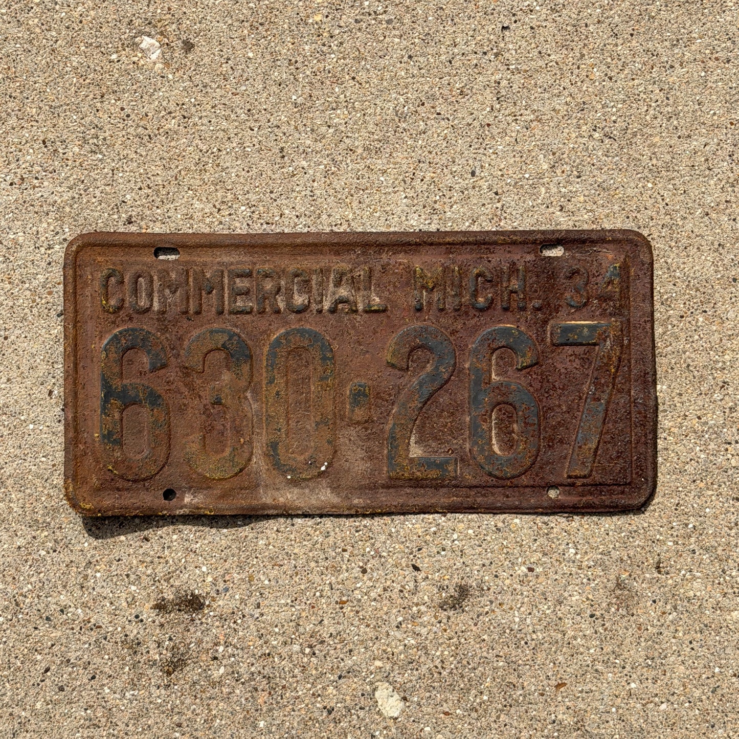 Photo of a 1934 Michigan Commercial License Plate Auto Tag Garage Decor Vintage 630 267 with original patina