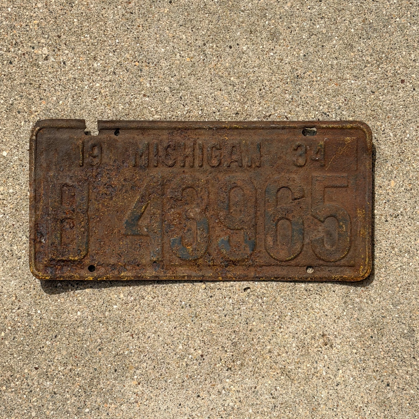 Photo of a 1934 Michigan License Plate Auto Tag Garage Decor Vintage 8 43965 with original patina