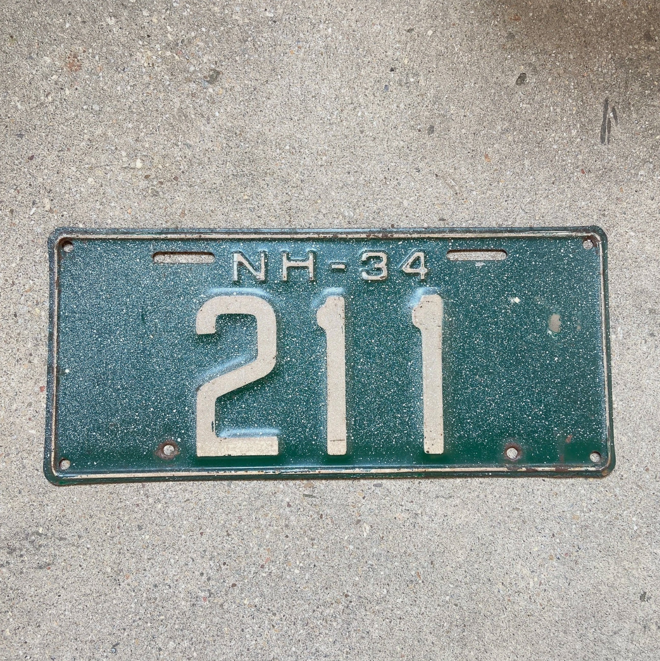 Photo of a 1934 New Hampshire License Plate Auto Tag Garage Decor Vintage Low Number Three Digit 211 with original patina
