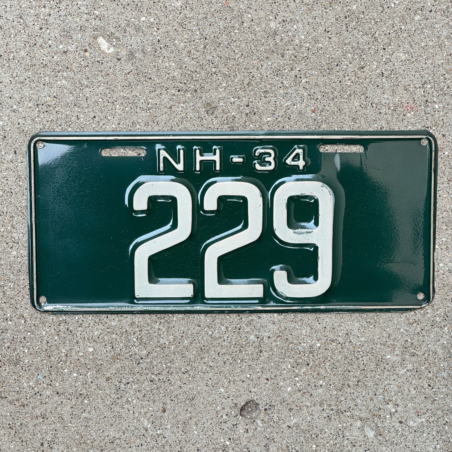 Photo of a 1934 New Hampshire License Plate Auto Tag Garage Decor Vintage Low Number Three Digit 229 with original patina