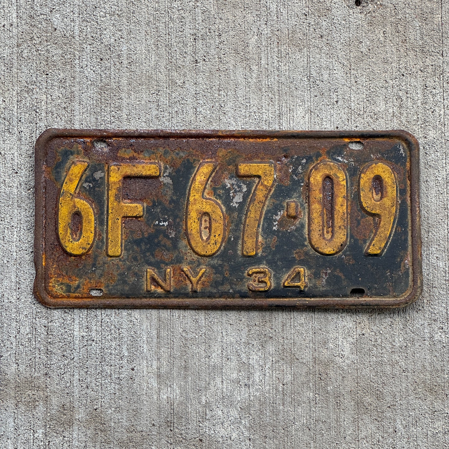 Photo of a 1934 New York License Plate Auto Tag Garage Decor Vintage 6F 67 09 with original patina