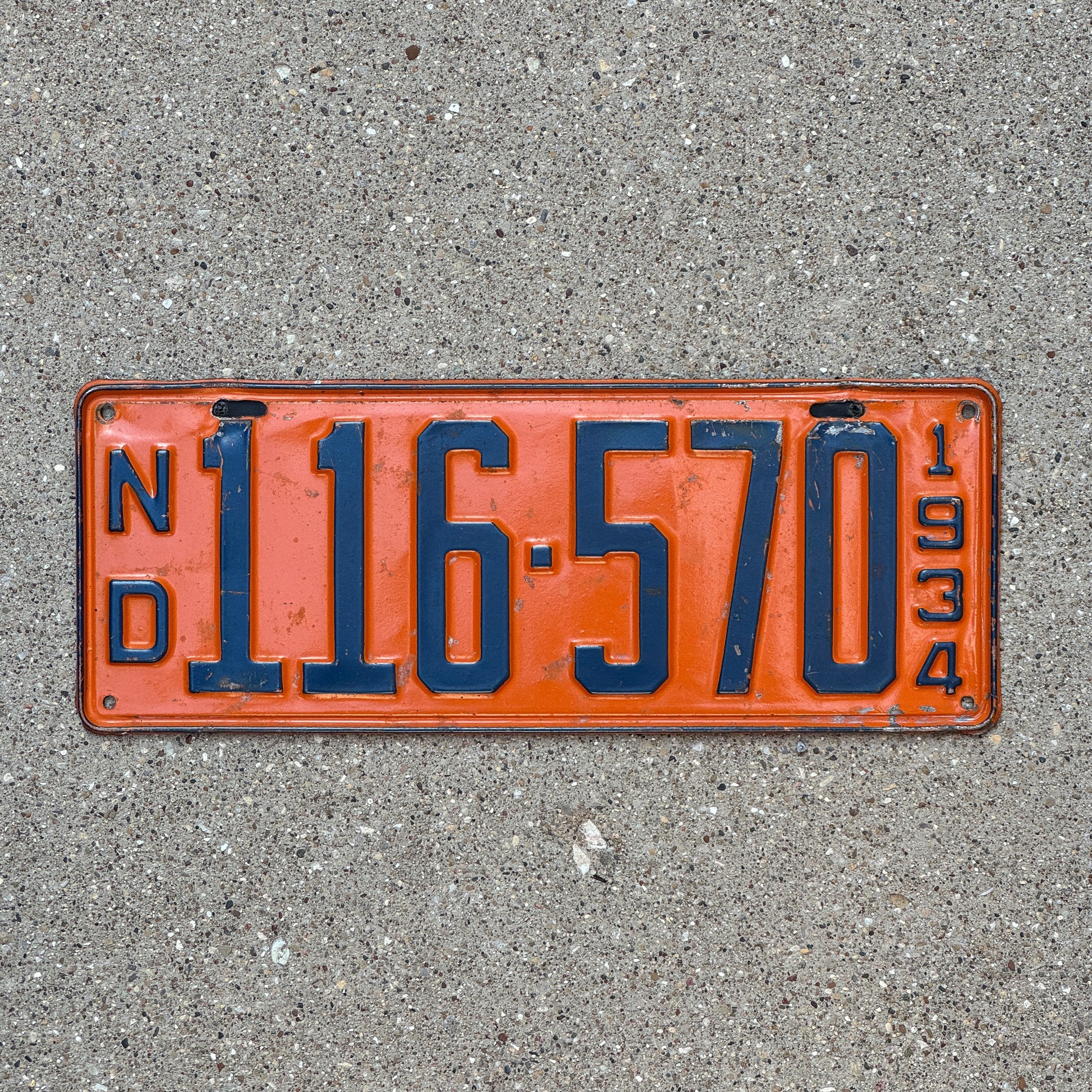 Photo of a 1934 North Dakota License Plate Auto Tag Garage Decor Vintage 116 570 with original patina