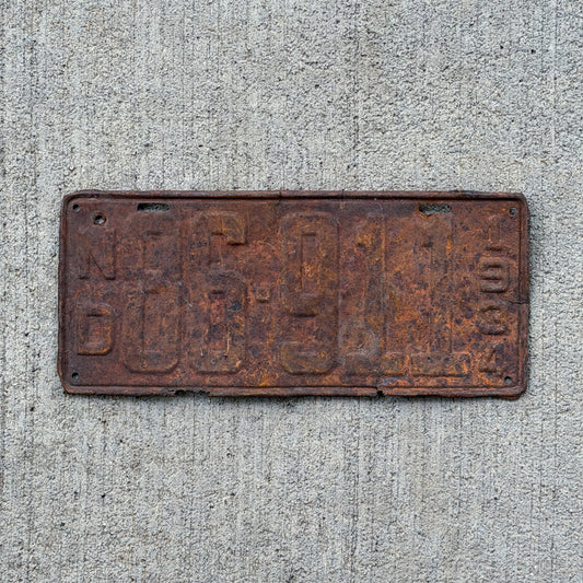 Photo of a 1934 North Dakota License Plate Auto Tag Garage Decor Vintage 86 911 with original patina