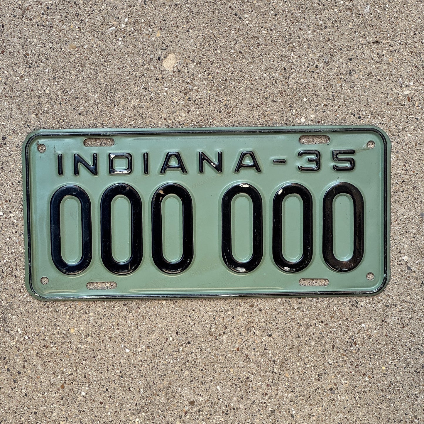 Photo of a 1935 Indiana Sample License Plate Auto Tag Garage Decor Vintage 000 000 with original patina