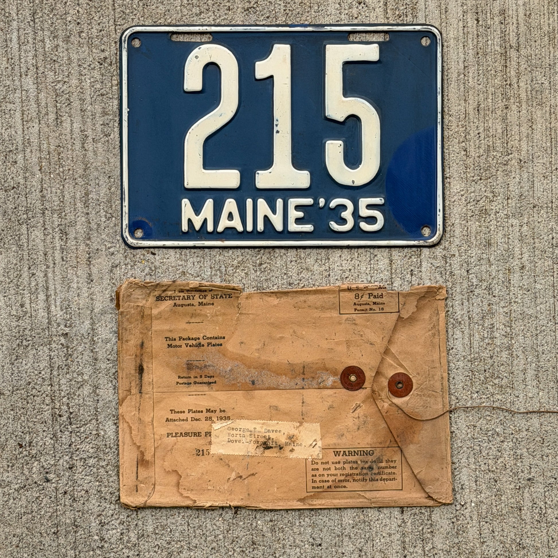 Photo of a 1935 Maine License Plate Auto Tag Garage Decor Vintage Low Number Three Digit with Mailing Envelope 215 with original patina