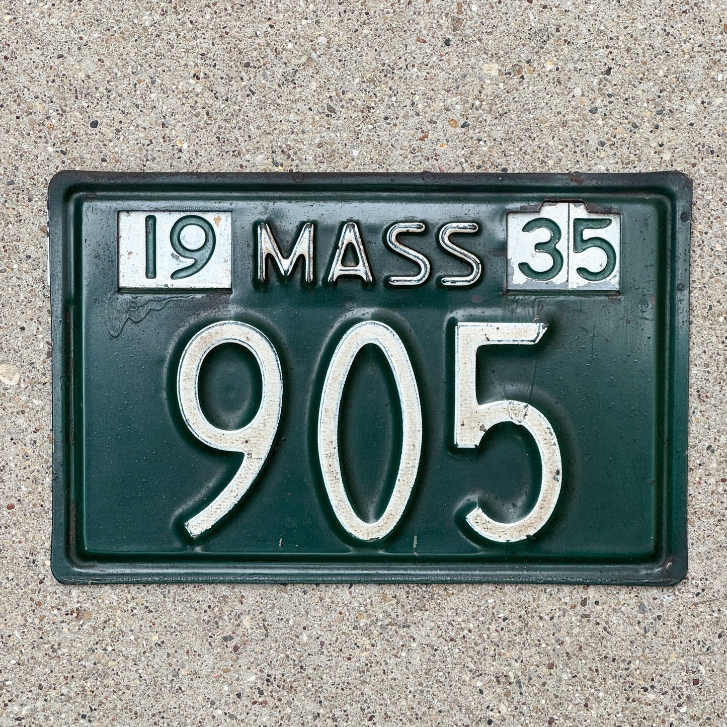 Photo of a 1935 Massachusetts License Plate Auto Tag Garage Decor Vintage Low Number Three Digit Experimental Date Strip 905 with original patina