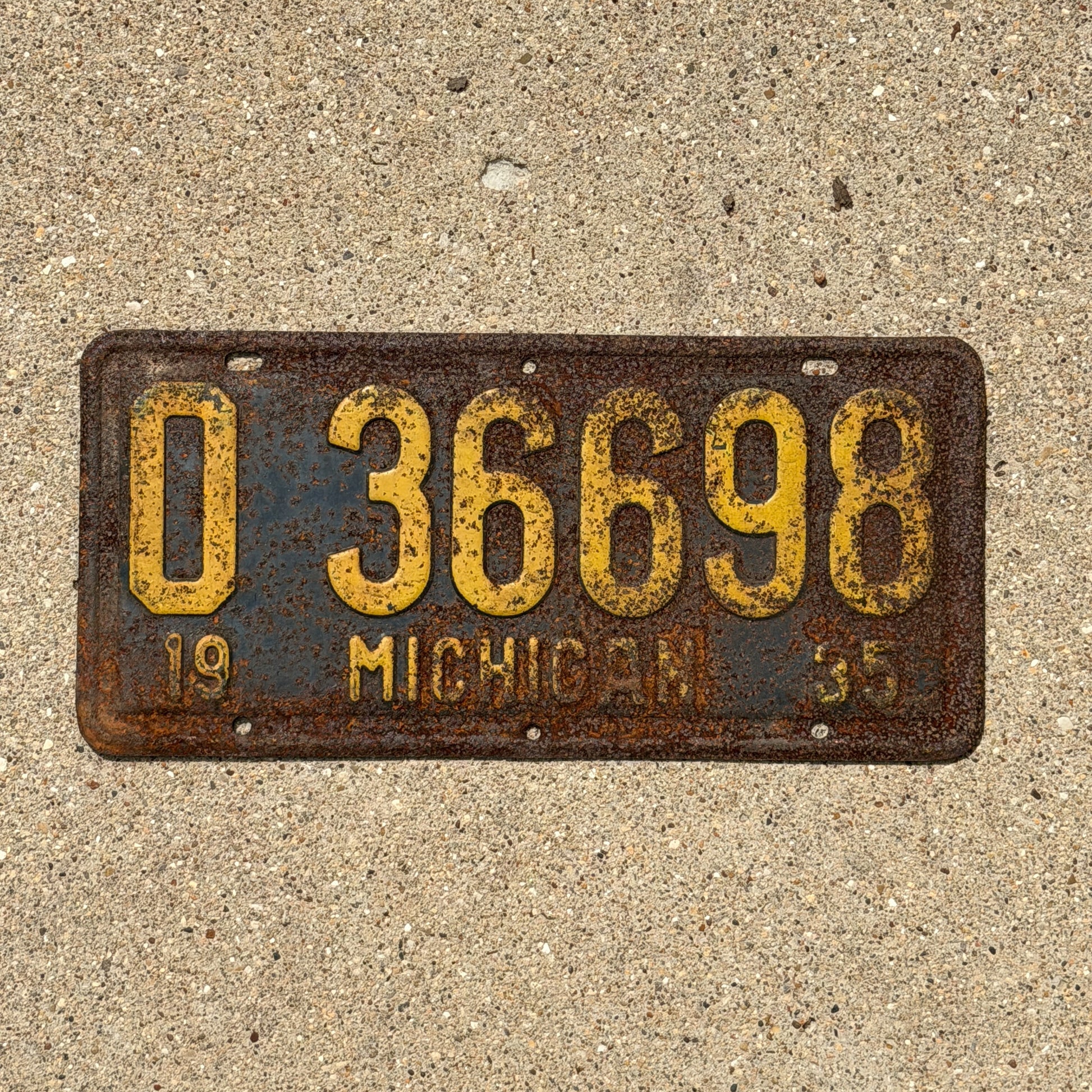 Photo of a 1935 Michigan License Plate Auto Tag Garage Decor Vintage 0 36698 with original patina