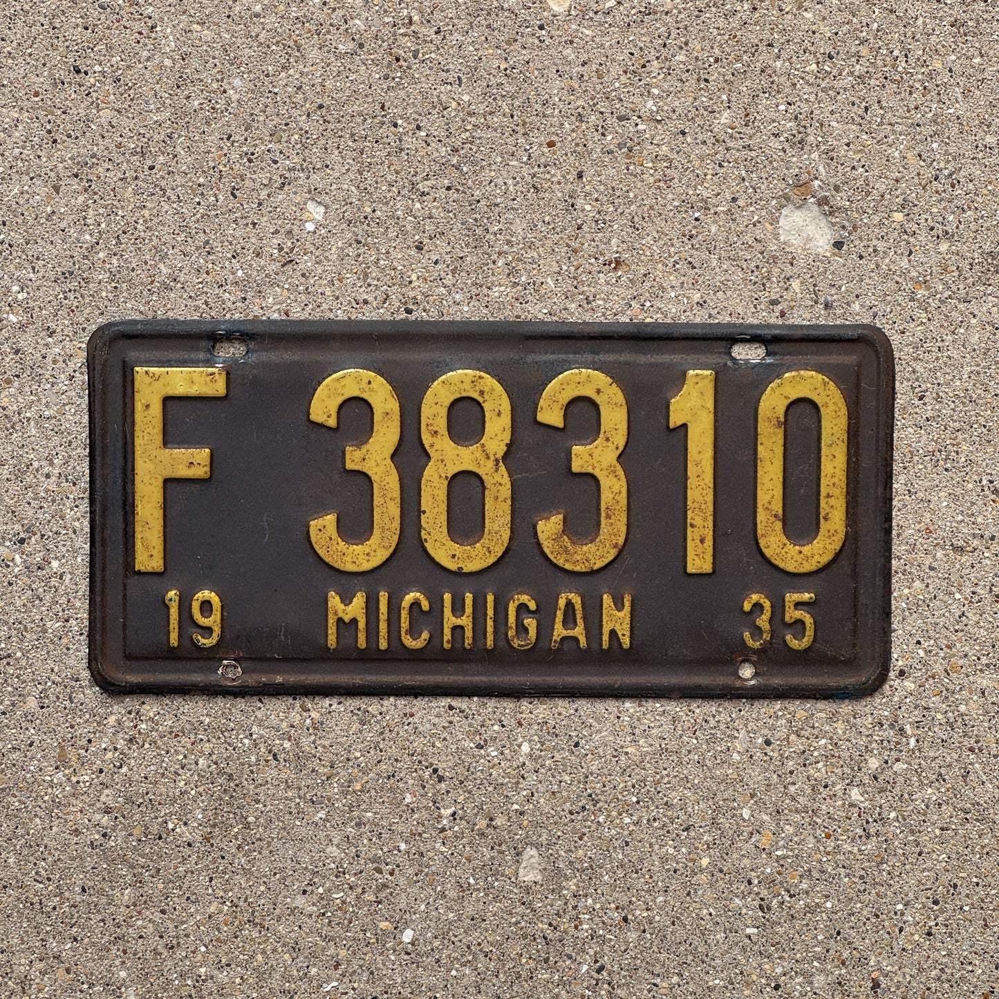Photo of a 1935 Michigan License Plate Auto Tag Garage Decor Vintage F 38310 with original patina