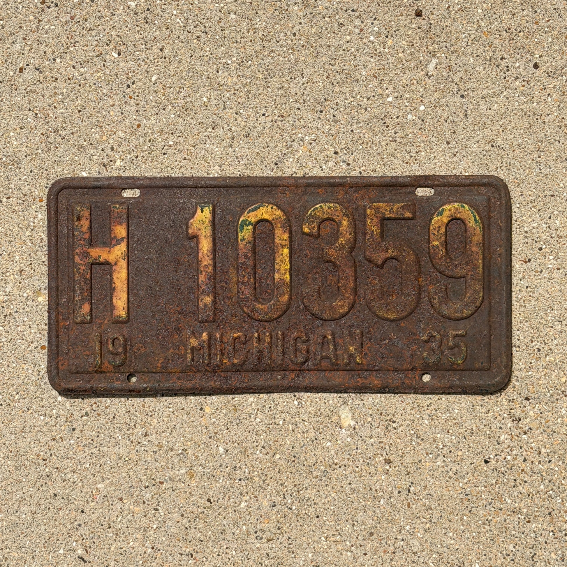 Photo of a 1935 Michigan License Plate Auto Tag Garage Decor Vintage H 10359 with original patina