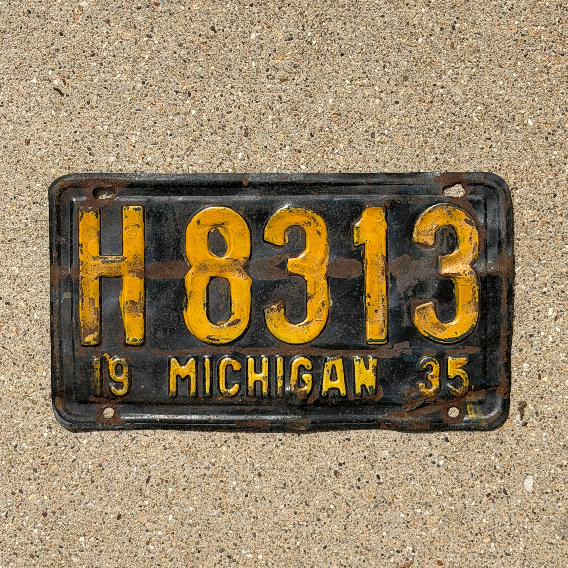 Photo of a 1935 Michigan License Plate Auto Tag Garage Decor Vintage H 8313 with original patina