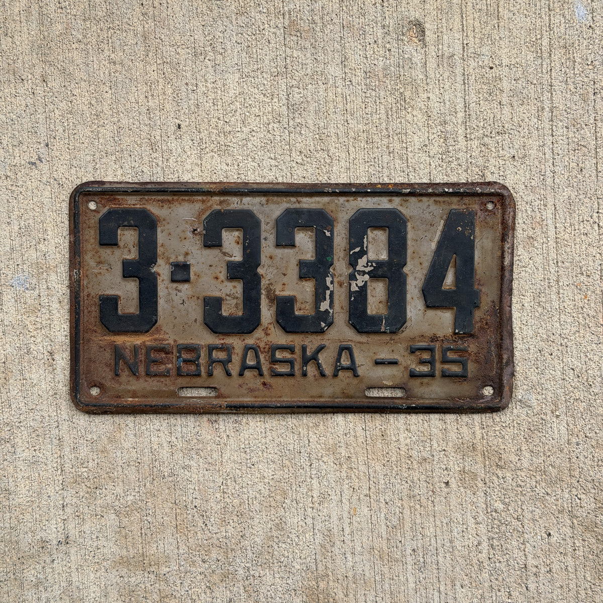 Photo of a 1935 Nebraska License Plate Auto Tag Garage Decor Vintage 3 3384 with original patina