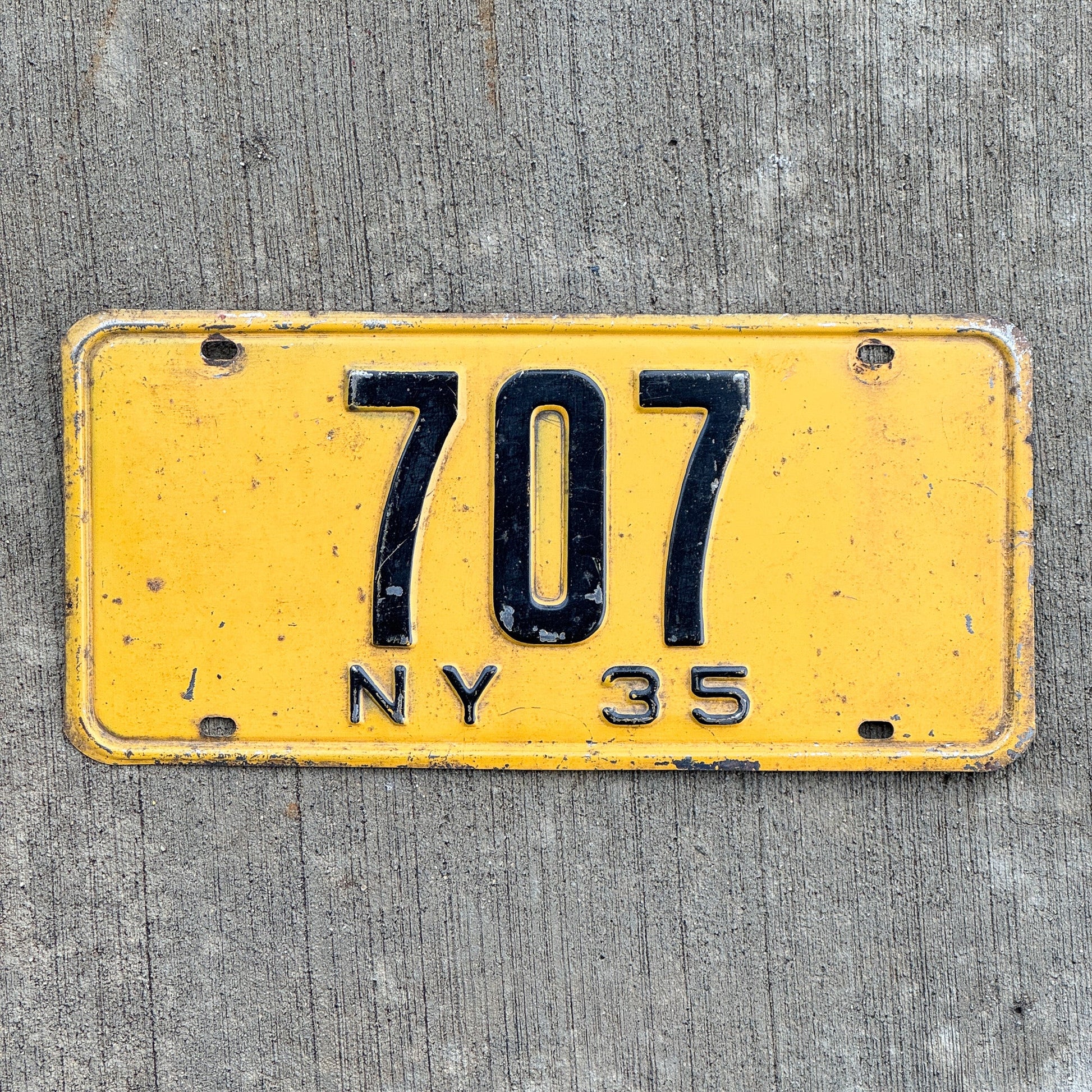 Photo of a 1935 New York Reserved License Plate Auto Tag Garage Decor Vintage ALPCA Archive Example Low Number Three Digit 707 with original patina