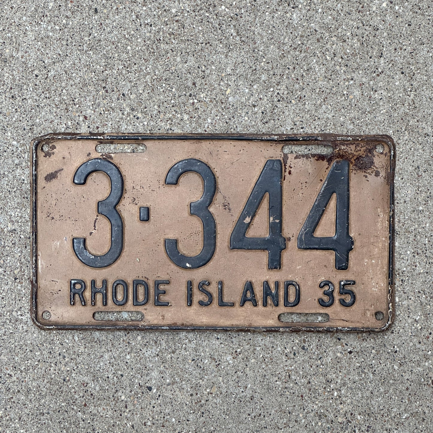 Photo of a 1935 Rhode Island License Plate Auto Tag Garage Decor Vintage Low Number Four Digit 3344 with original patina