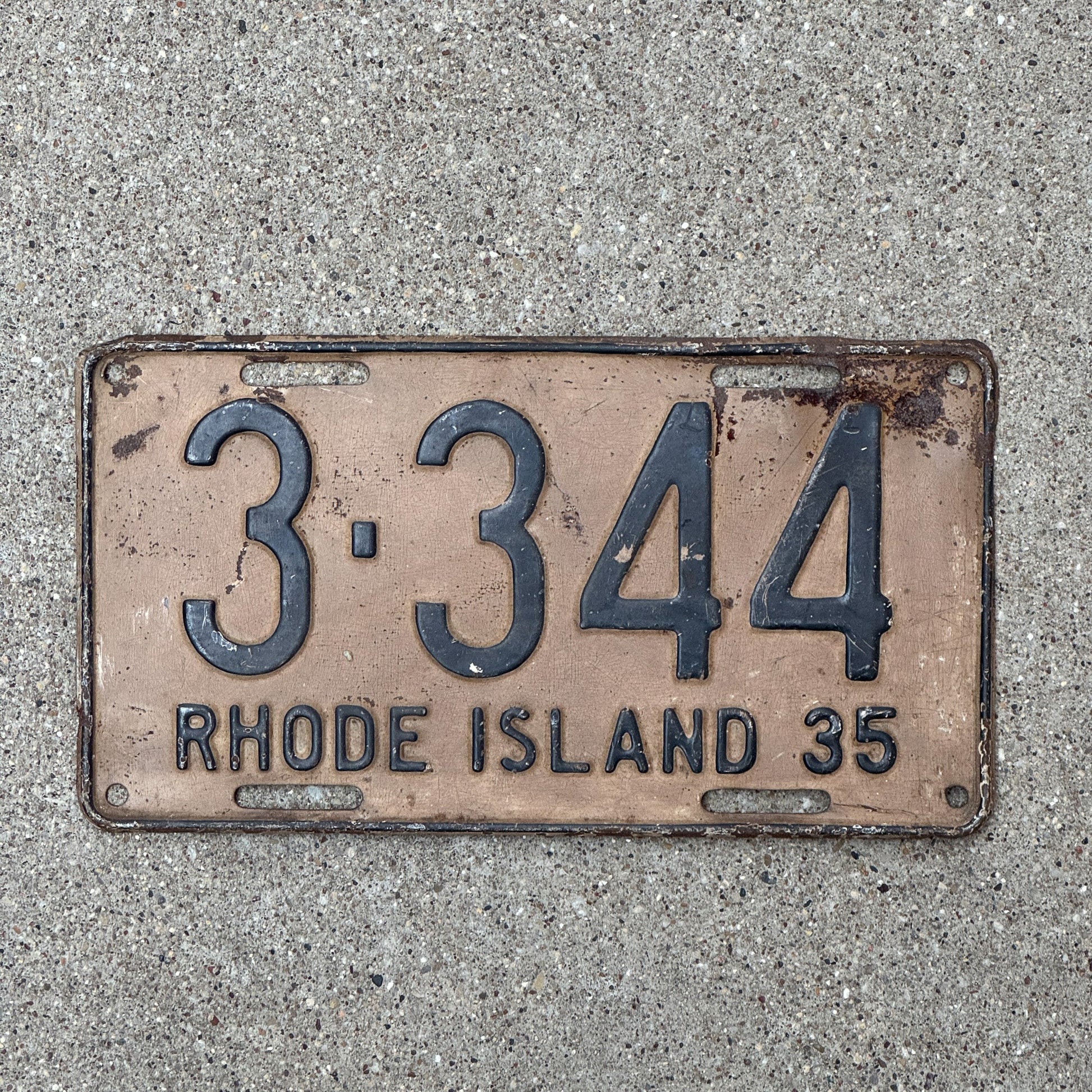 Photo of a 1935 Rhode Island License Plate Auto Tag Garage Decor Vintage Low Number Four Digit 3344 with original patina