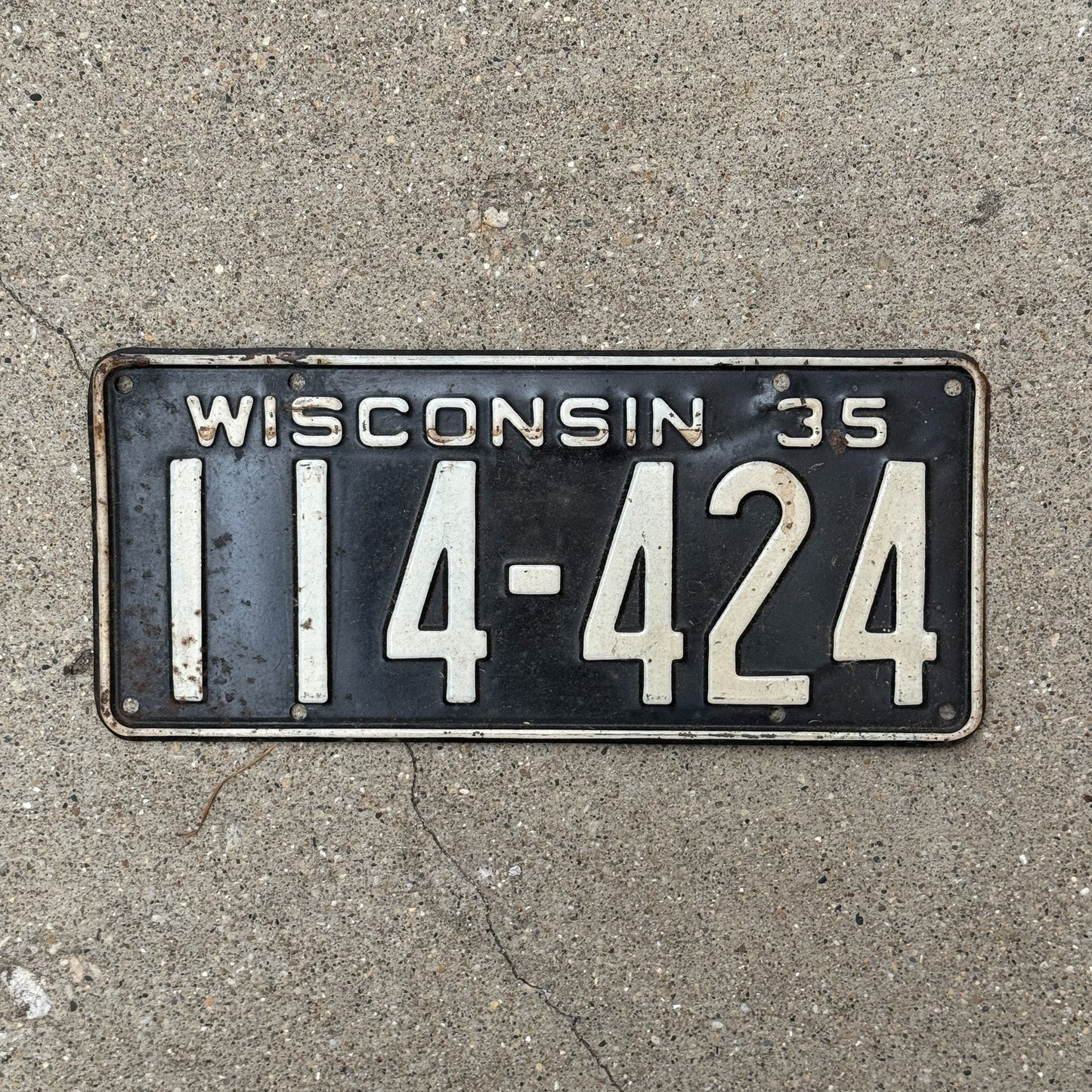 Photo of a 1935 Wisconsin License Plate Auto Tag Garage Decor Vintage 114 424 with original patina