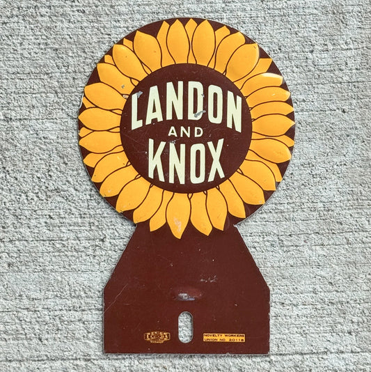 Photo of a 1936 Landon Knox License Plate Topper Auto Tag Garage Decor Vintage Sunflower Flower USA Republican Political President with original patina