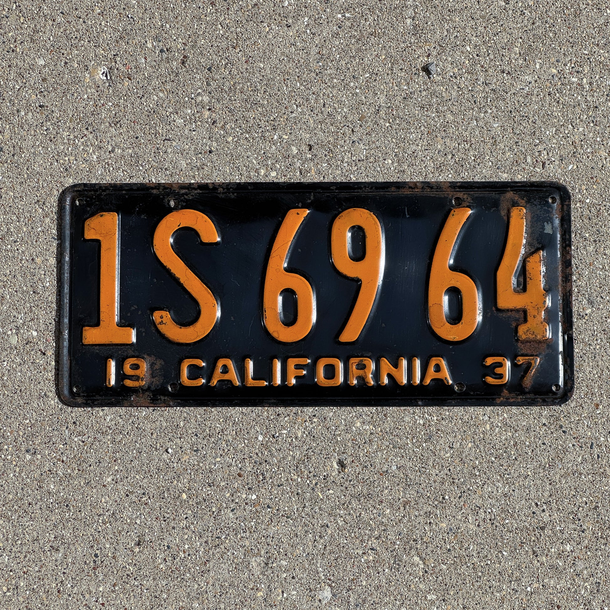 Photo of a 1937 California License Plate Auto Tag Garage Decor Vintage 1S 69 64 with original patina