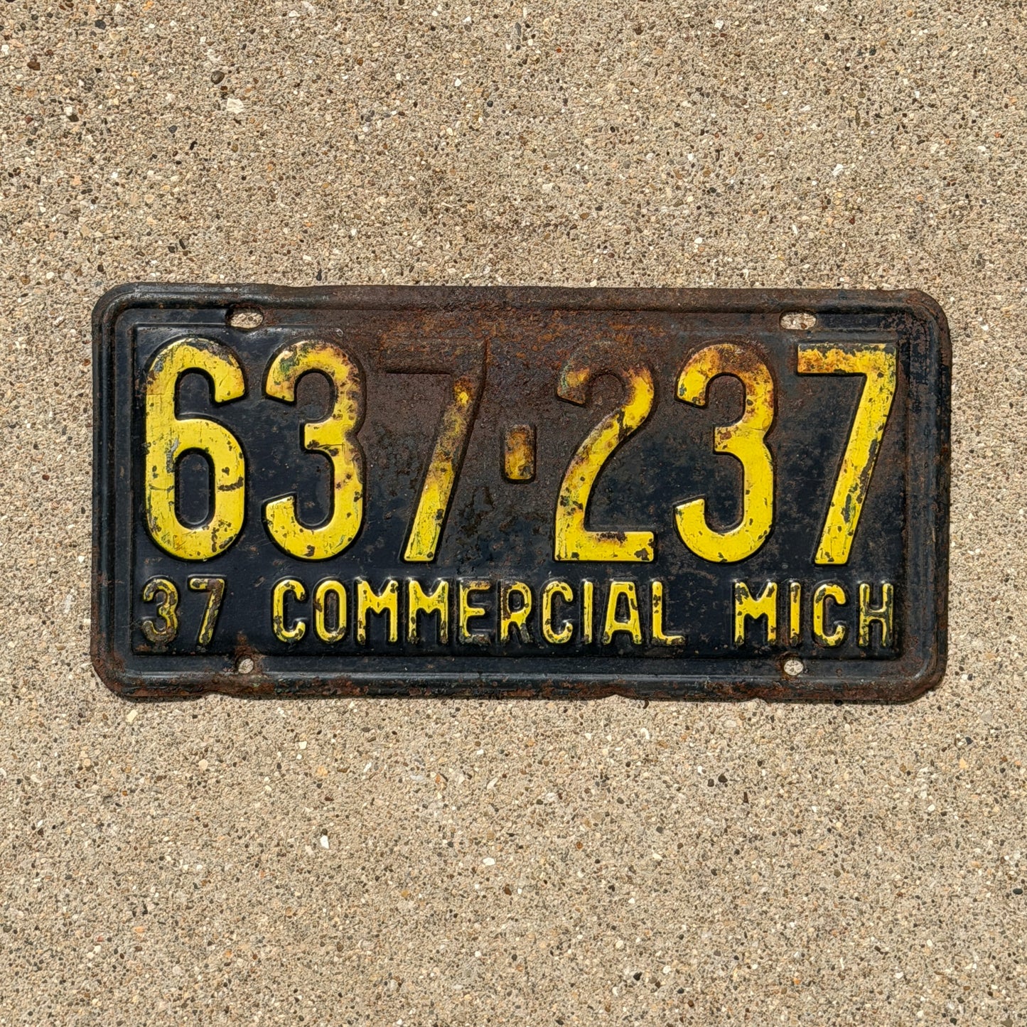 Photo of a 1937 Michigan Commercial License Plate Auto Tag Garage Decor Vintage 637 237 with original patina