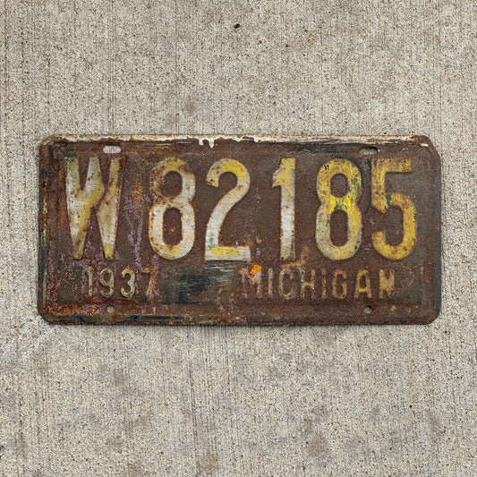 Photo of a 1937 Michigan License Plate Auto Tag 2 Vintage Garage W 82185 with original patina