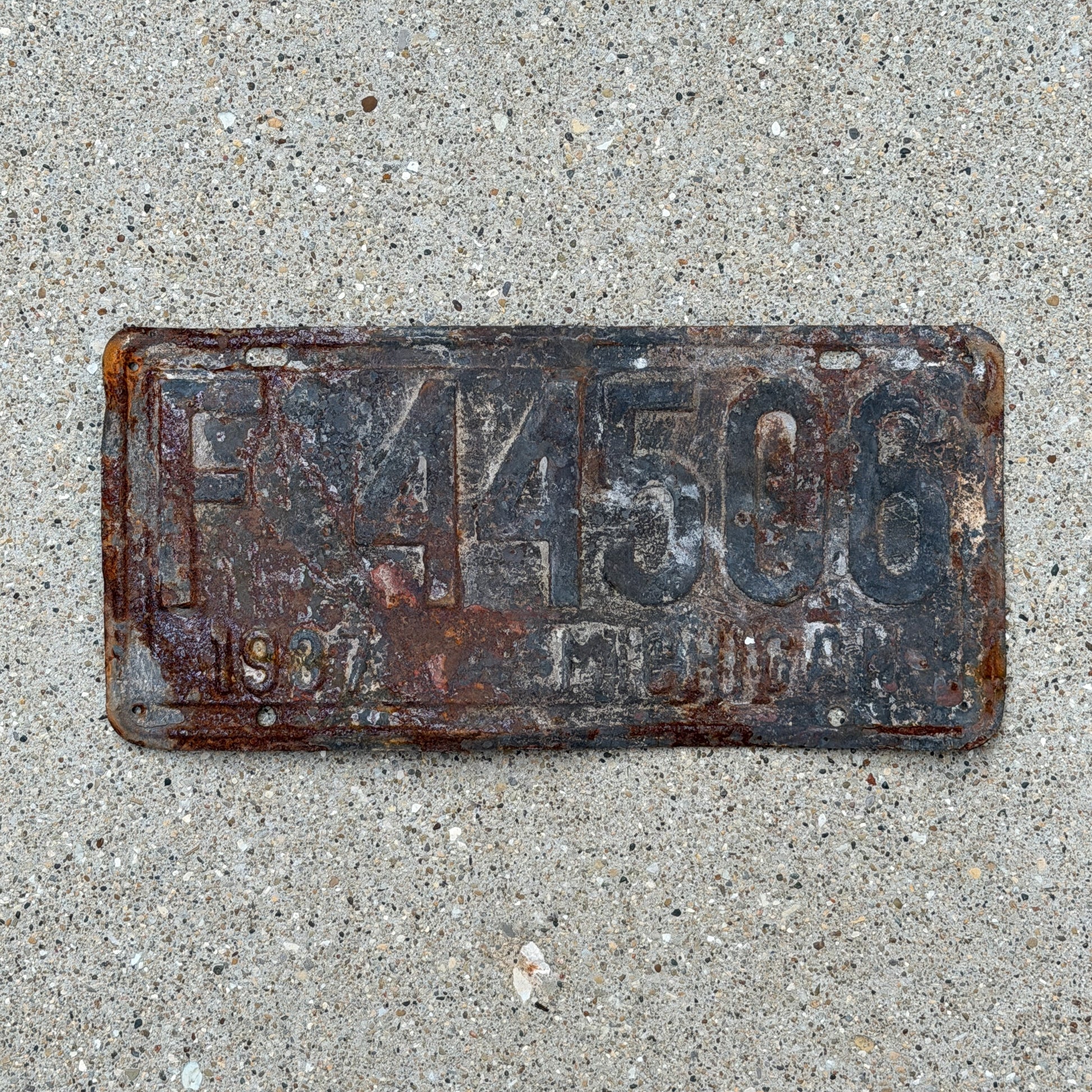 Photo of a 1937 Michigan License Plate Auto Tag Garage Decor Vintage F 44506 with original patina