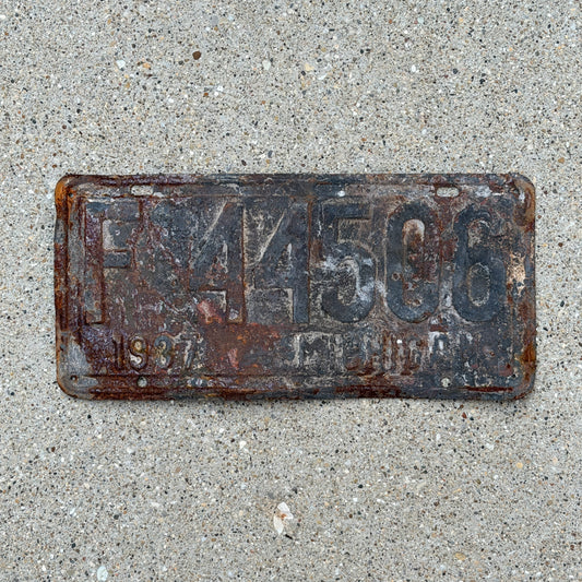 Photo of a 1937 Michigan License Plate Auto Tag Garage Decor Vintage F 44506 with original patina