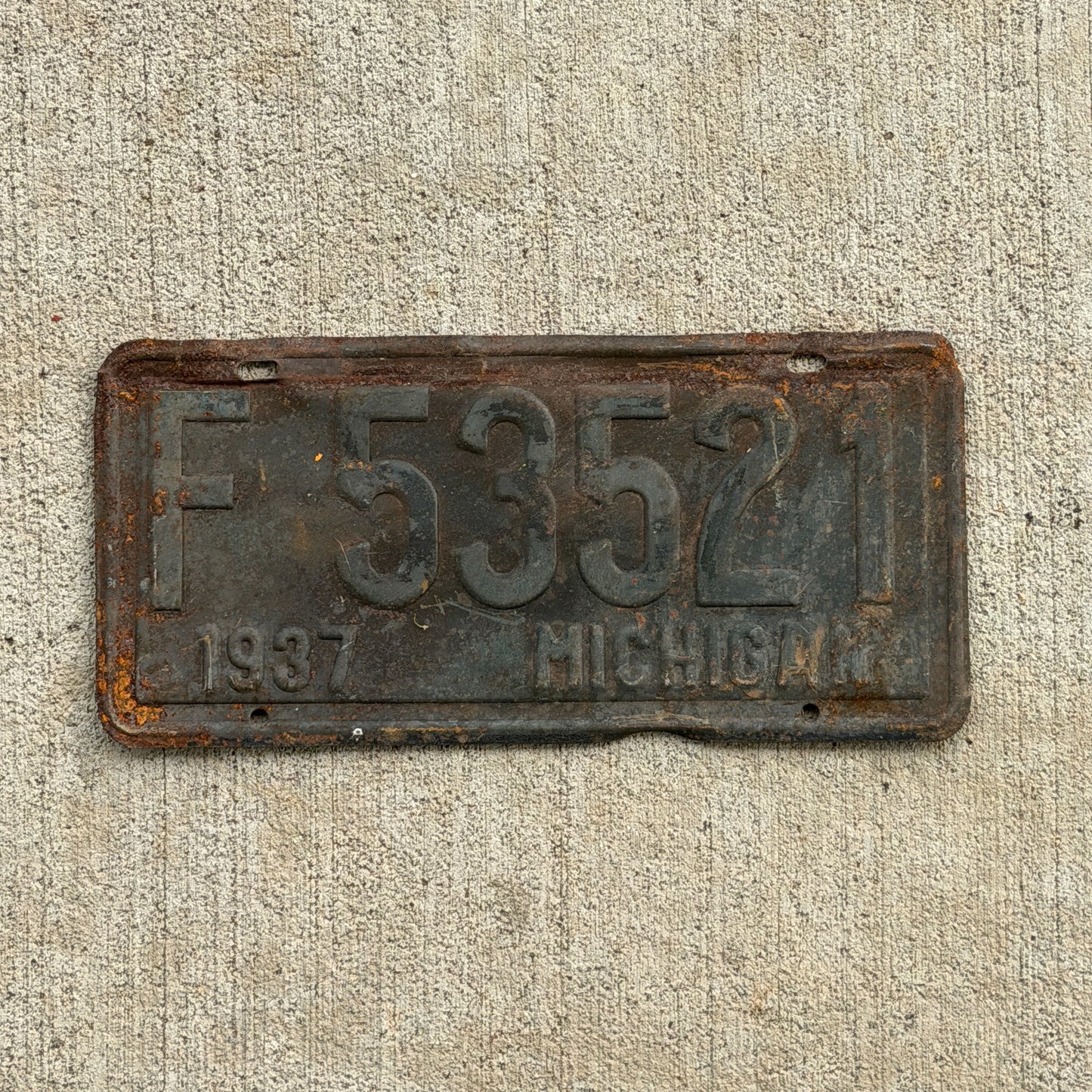 Photo of a 1937 Michigan License Plate Auto Tag Garage Decor Vintage F 53521 with original patina