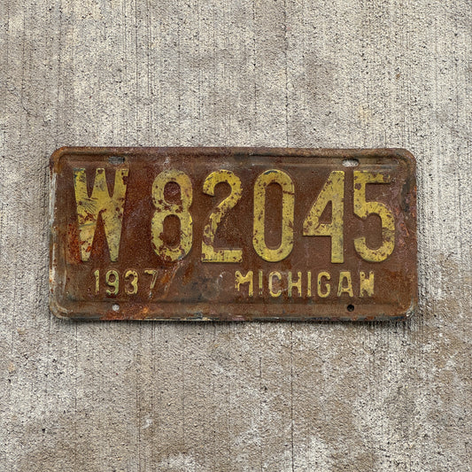 Photo of a 1937 Michigan License Plate Auto Tag Garage Decor Vintage W 82045 with original patina