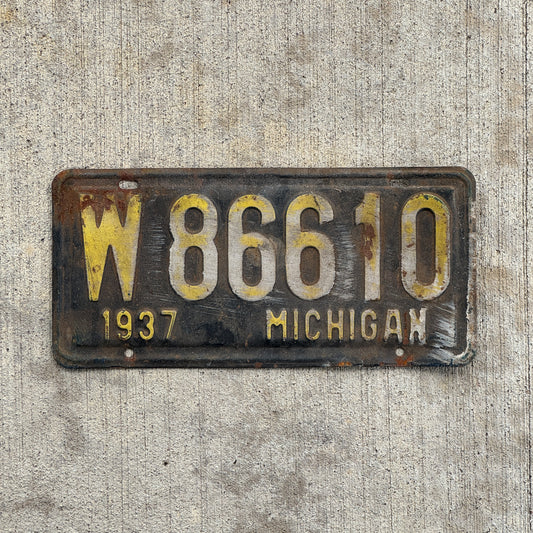 Photo of a 1937 Michigan License Plate Auto Tag Garage Decor Vintage W 86610 with original patina