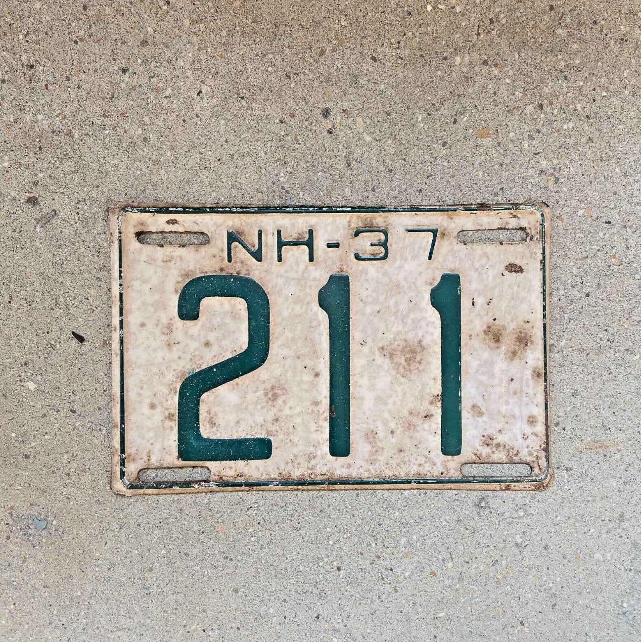 Photo of a 1937 New Hampshire License Plate Auto Tag Garage Decor Vintage Low Number Three Digit 211 with original patina