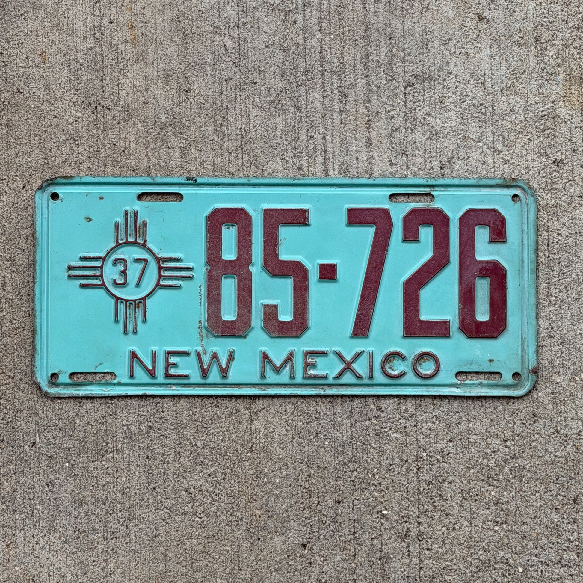 Photo of a 1937 New Mexico License Plate Auto Tag Garage Decor Vintage Teal Zia 85 726 with original patina
