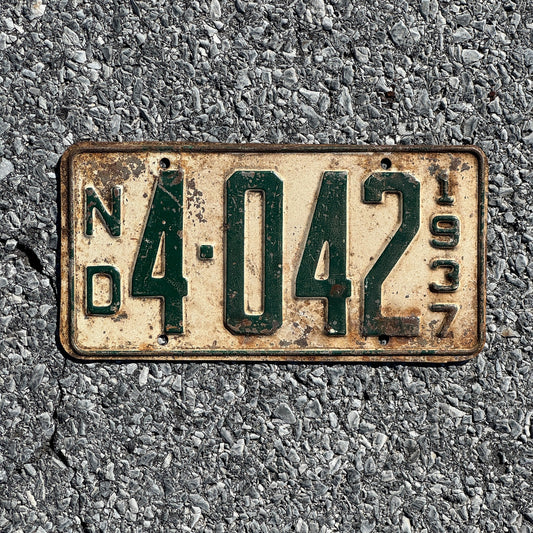 Photo of a 1937 North Dakota License Plate Auto Tag Garage Decor Vintage Four Digit Low Number 4042