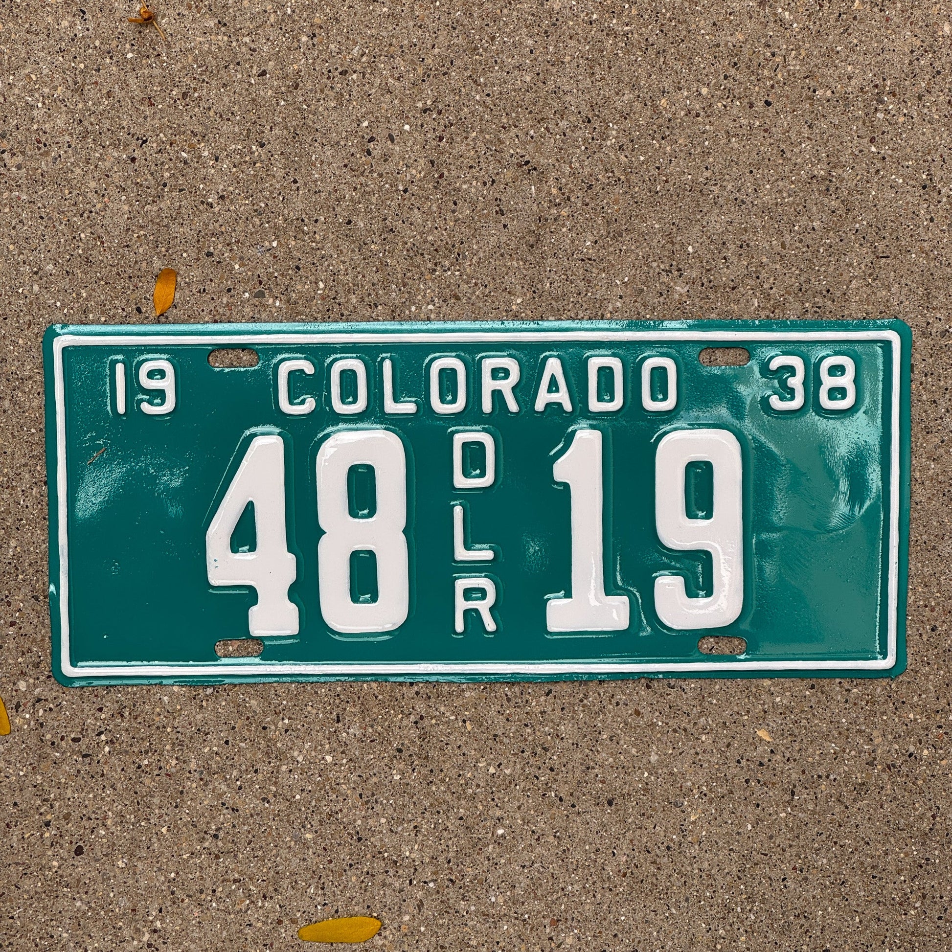 Photo of a 1938 Colorado Dealer License Plate Auto Tag Garage Decor Vintage 48 19 with original patina