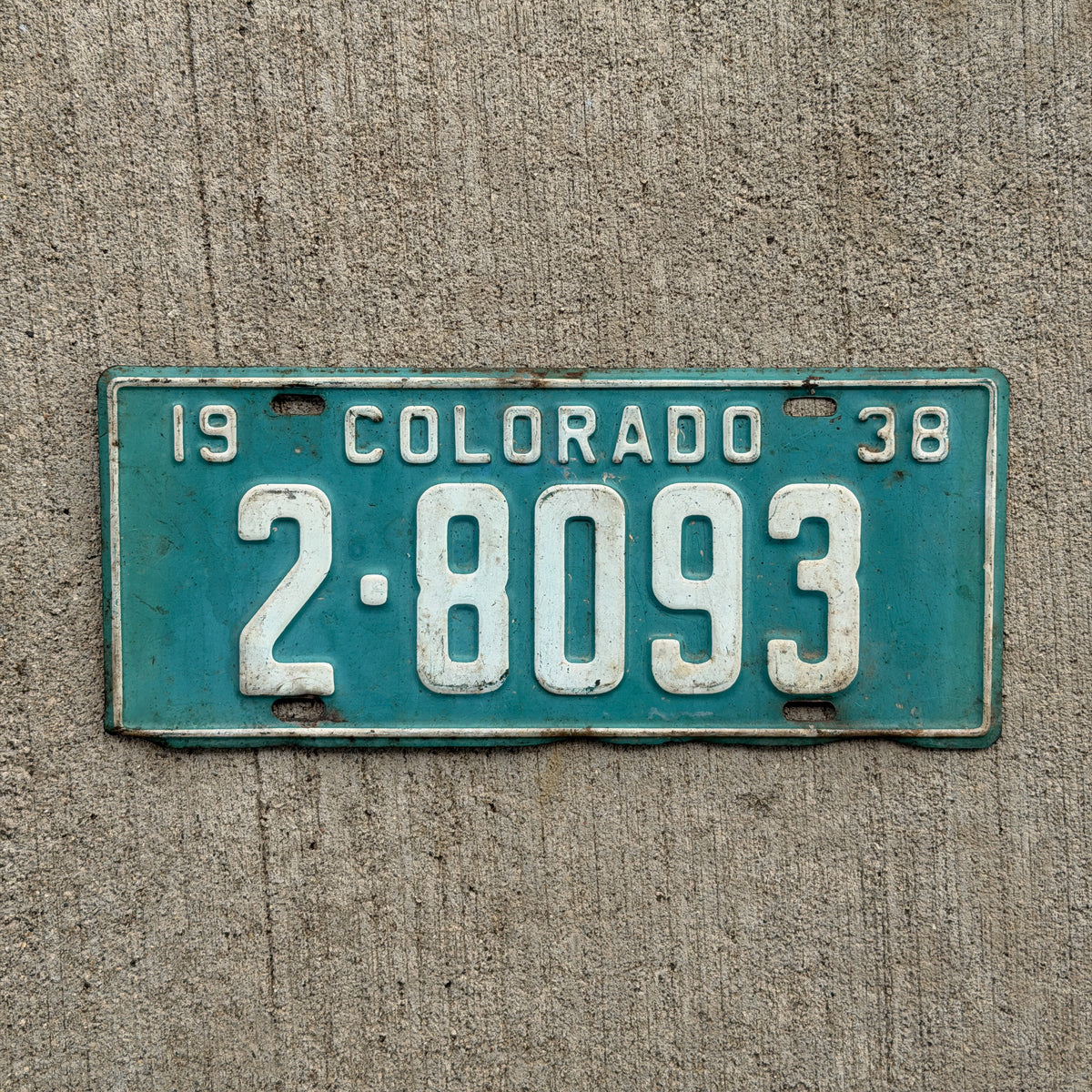 Photo of a 1938 Colorado License Plate Auto Tag Garage Decor Vintage Pueblo County 2 8093 with original patina