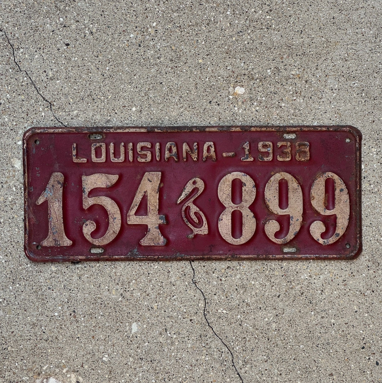 Photo of a 1938 Louisiana License Plate Auto Tag Garage Decor Vintage Iconic Pelicn 154 899 with original patina