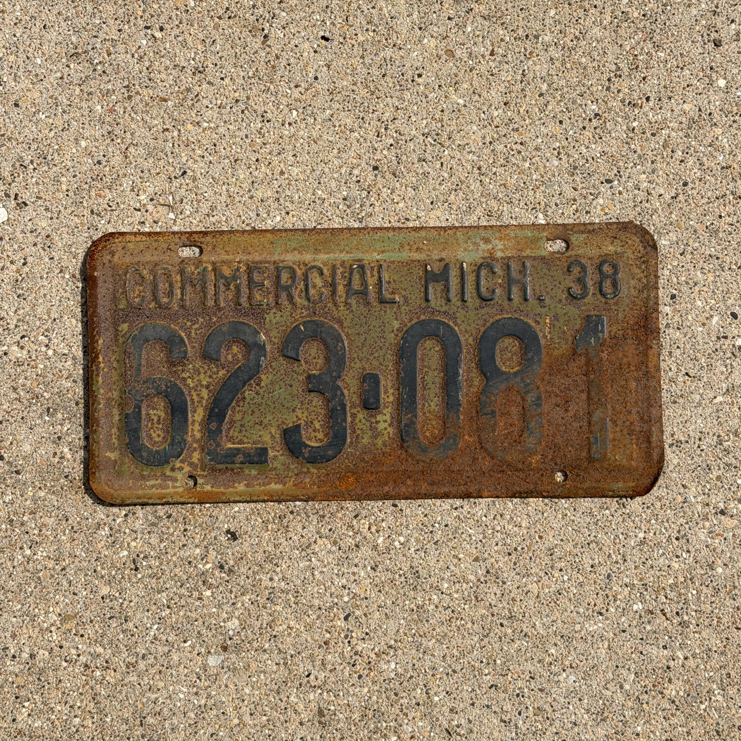 Photo of a 1938 Michigan Commercial License Plate Auto Tag Garage Decor Vintage 623 081 with original patina