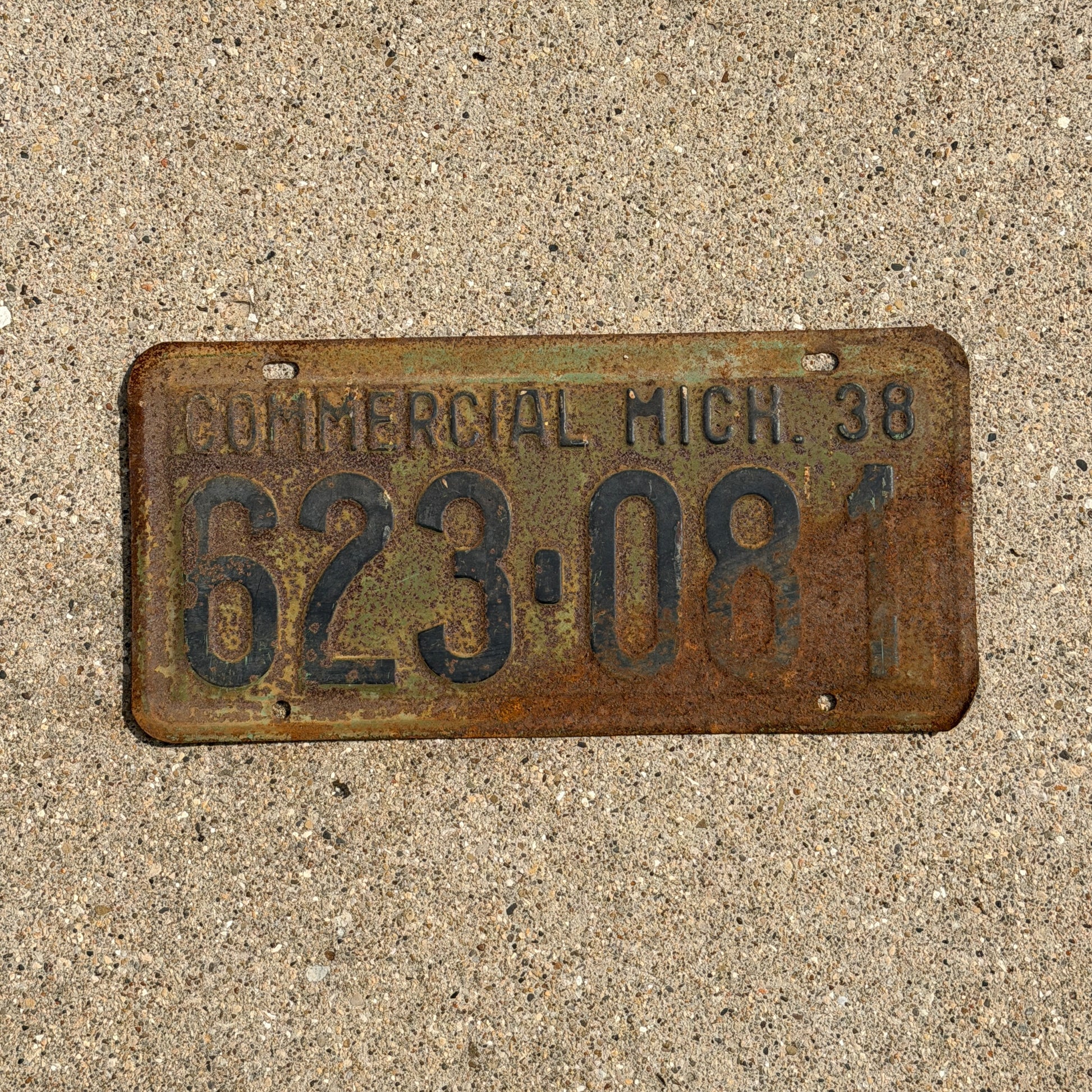 Photo of a 1938 Michigan Commercial License Plate Auto Tag Garage Decor Vintage 623 081 with original patina