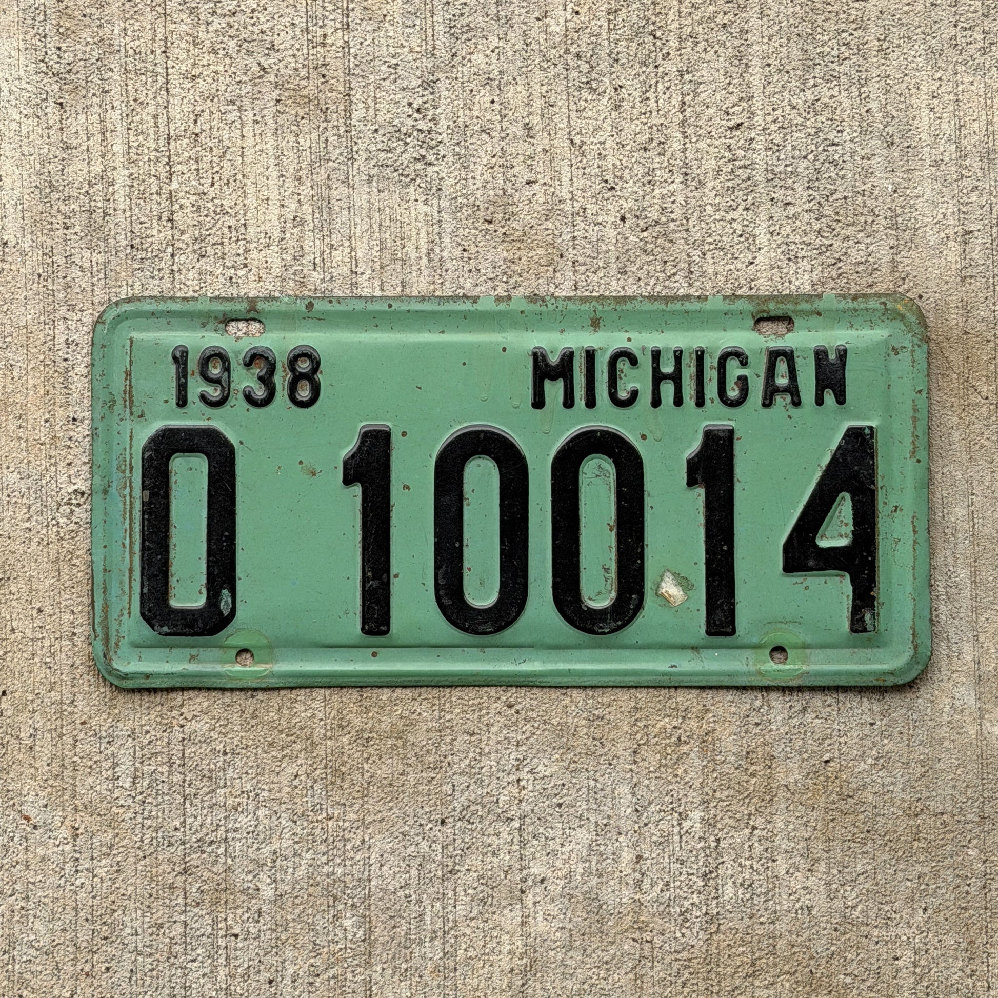 Photo of a 1938 Michigan License Plate Auto Tag Garage Decor Vintage O 10014 with original patina