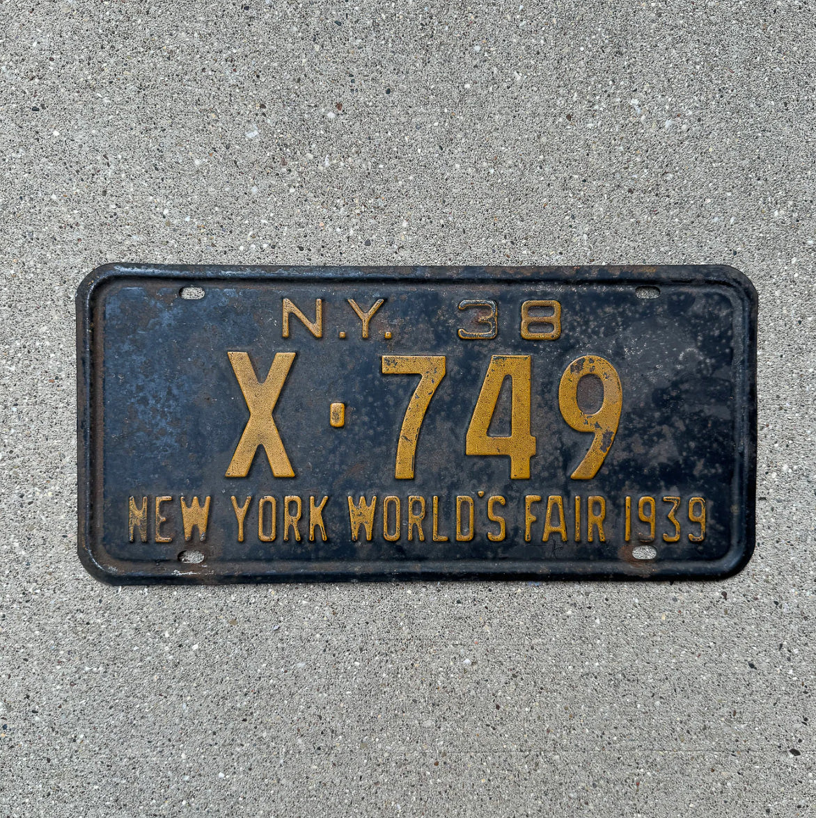 Photo of a 1938 New York License Plate Auto Tag Garage Decor Vintage World's Fair X 749 with original patina