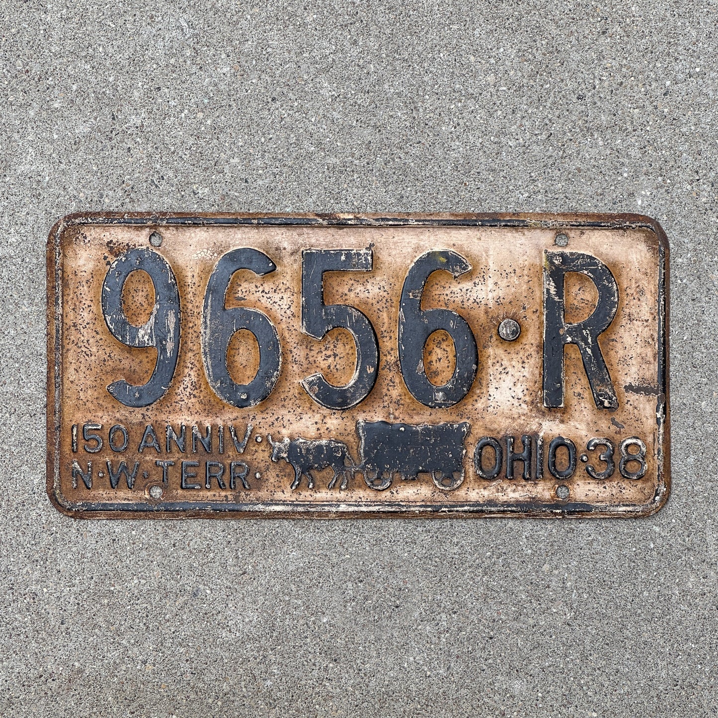 Photo of a 1938 Ohio License Plate Auto Tag Garage Decor Vintage Iconic Covered Wagon 9656 R with original patina