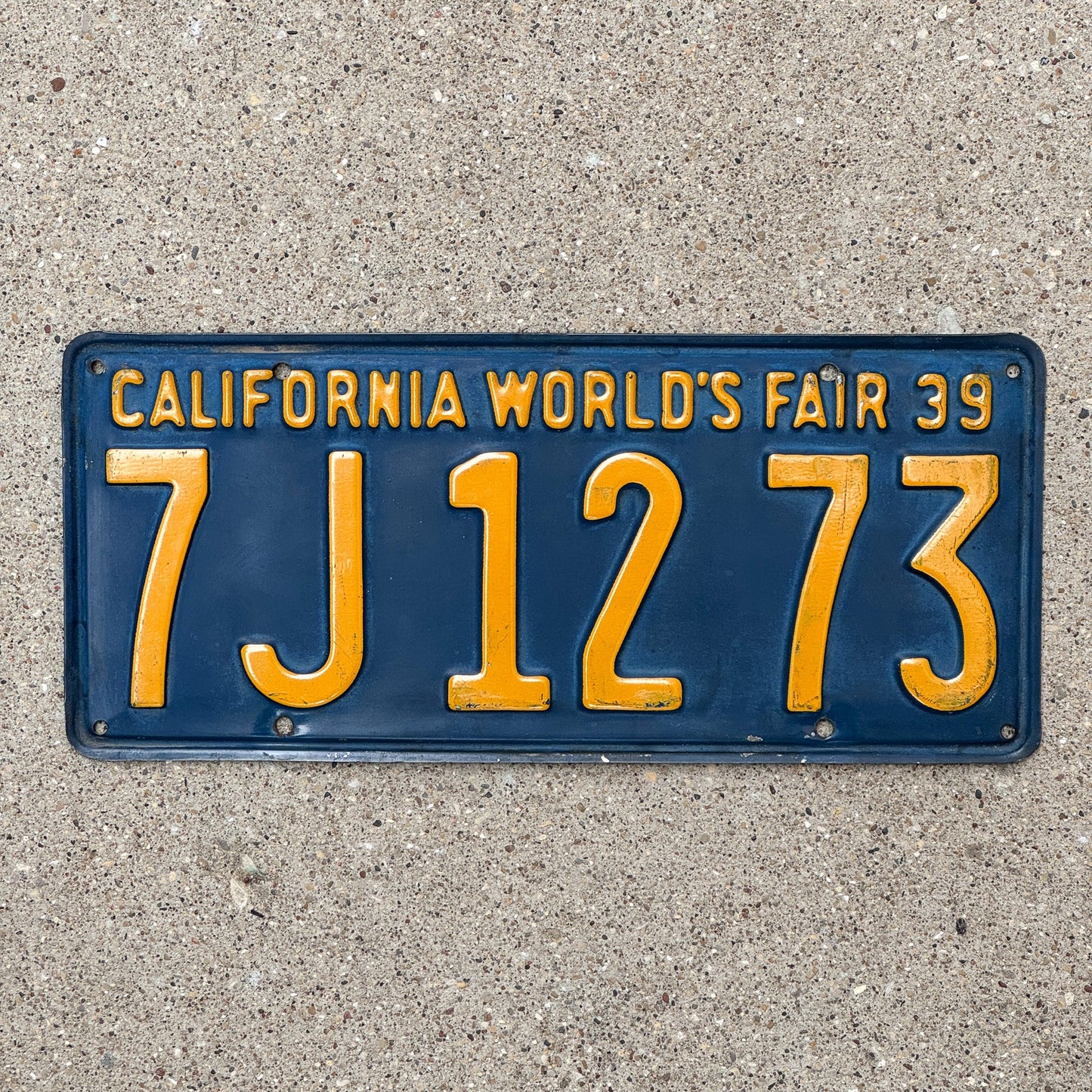 Photo of a 1939 California License Plate Auto Tag Garage Decor Vintage World's Fair 7 J 1273 with original patina