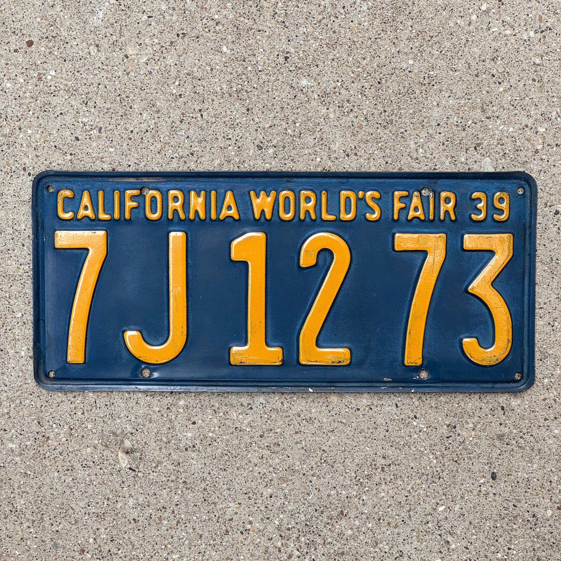 Photo of a 1939 California License Plate Auto Tag Garage Decor Vintage World's Fair 7 J 1273 with original patina