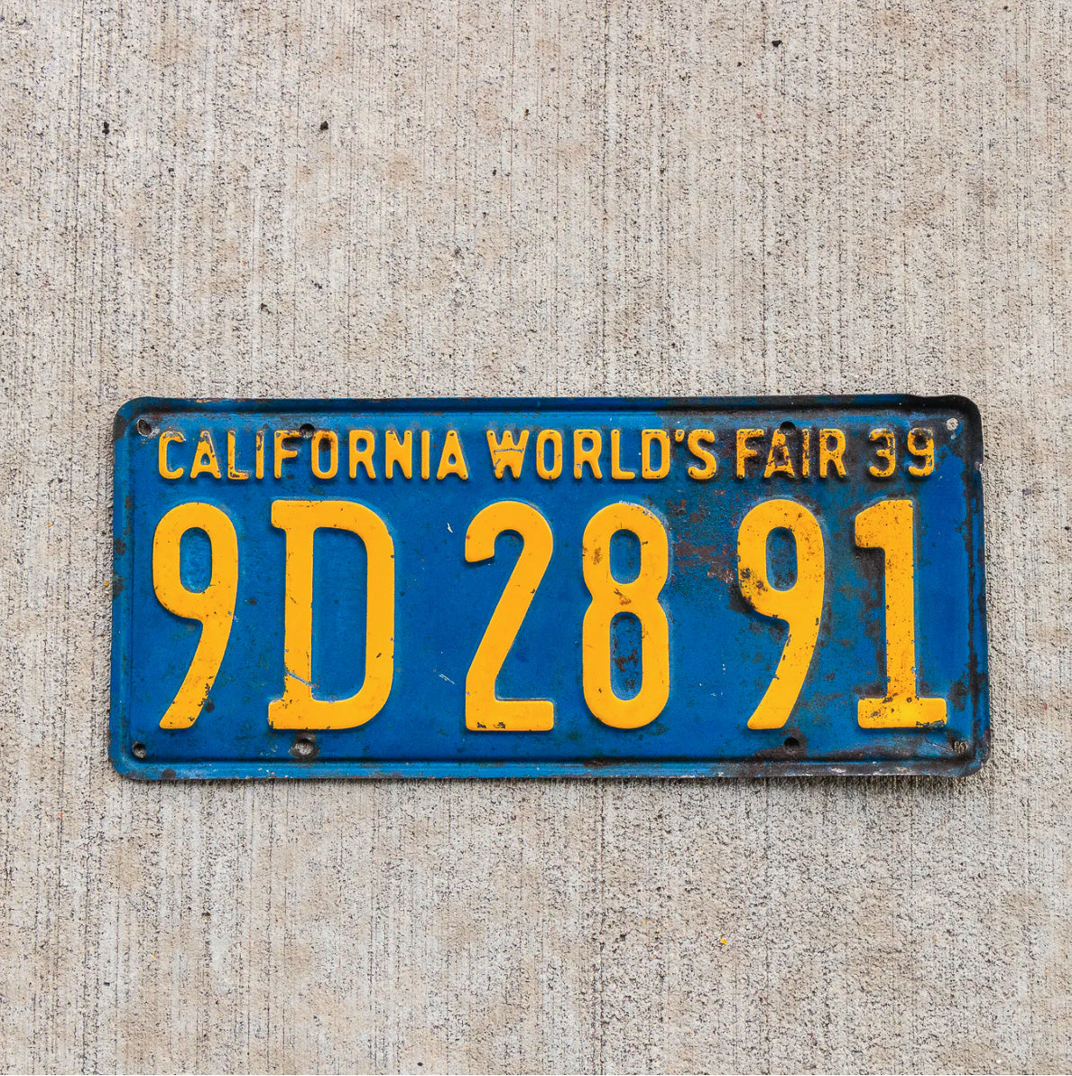 Photo of a 1939 California License Plate Auto Tag Garage Decor Vintage World's Fair 9D 2891 with original patina