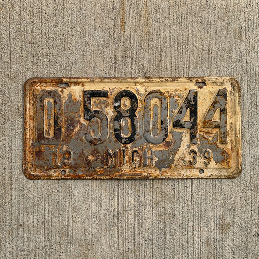 Photo of a 1939 Michigan License Plate Auto Tag Garage Decor Vintage 0 58044 with original patina